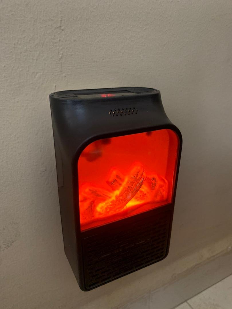 Chauffage Électrique Portable avec Effet Flamme 3D – مدفأة كهربائية محمولة بتأثير اللهب ثلاثي الأبعاد